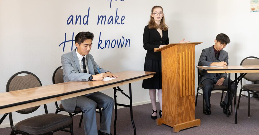 Student giving a homeschool speech and debate presentation