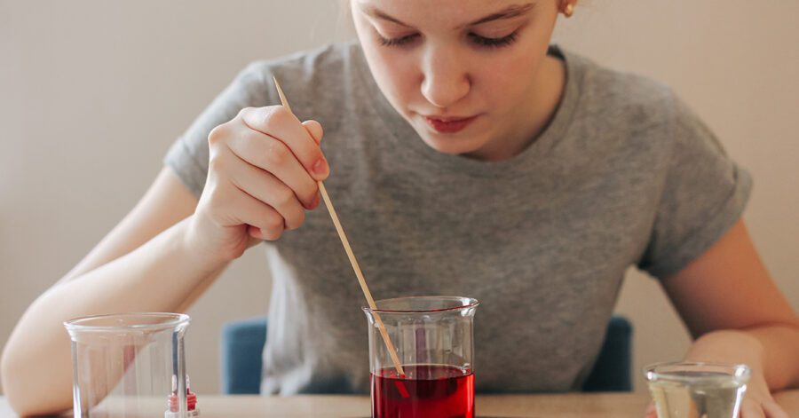 Homeschool student doing a chemistry experiment