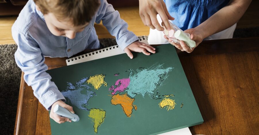 Interactive, hands-on geography activities: a boy learns about maps, geography, and cartography.