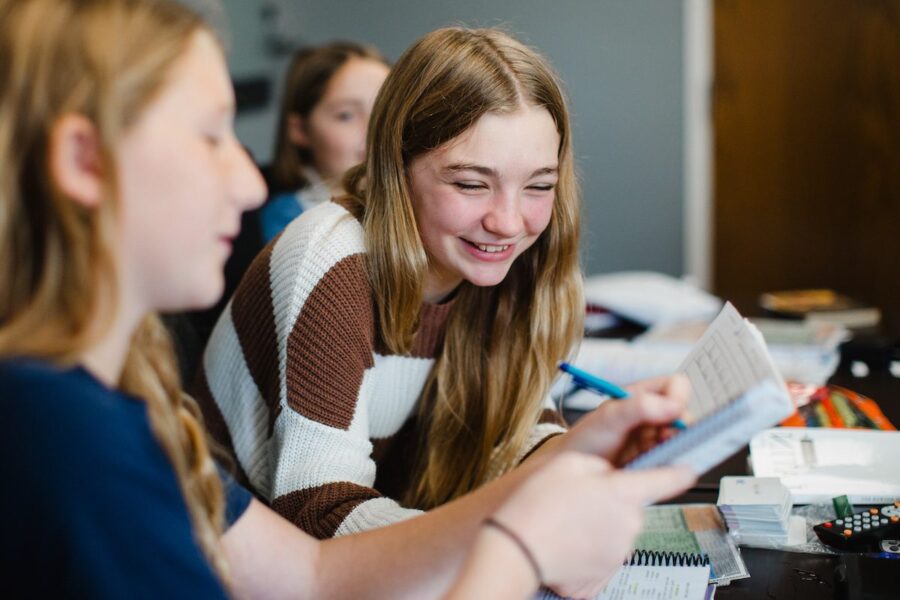 Homeschool students learning in a community