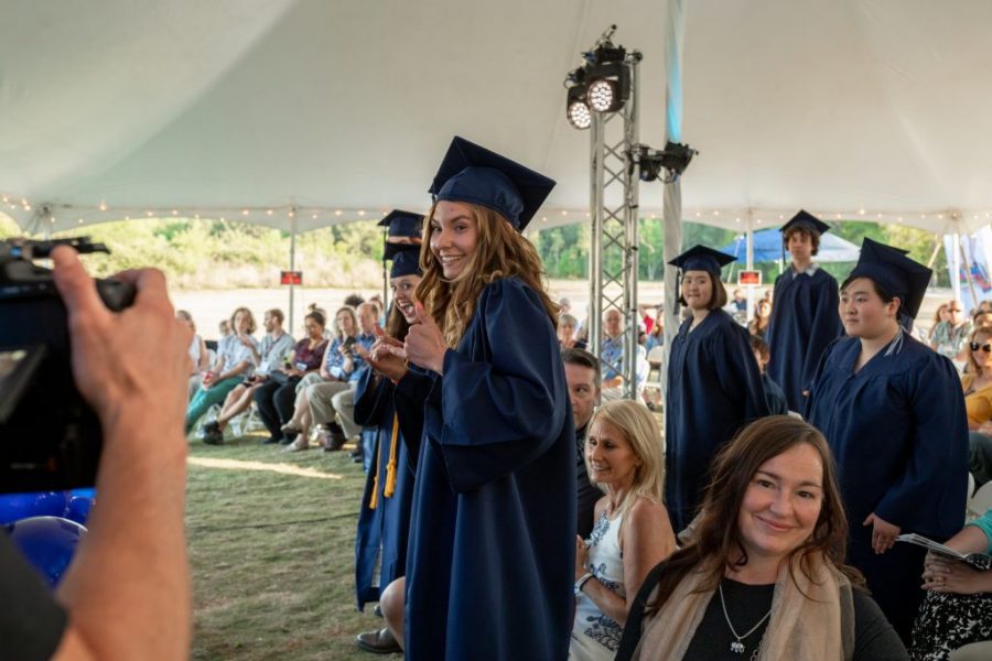 graduates smiling at National Commencement