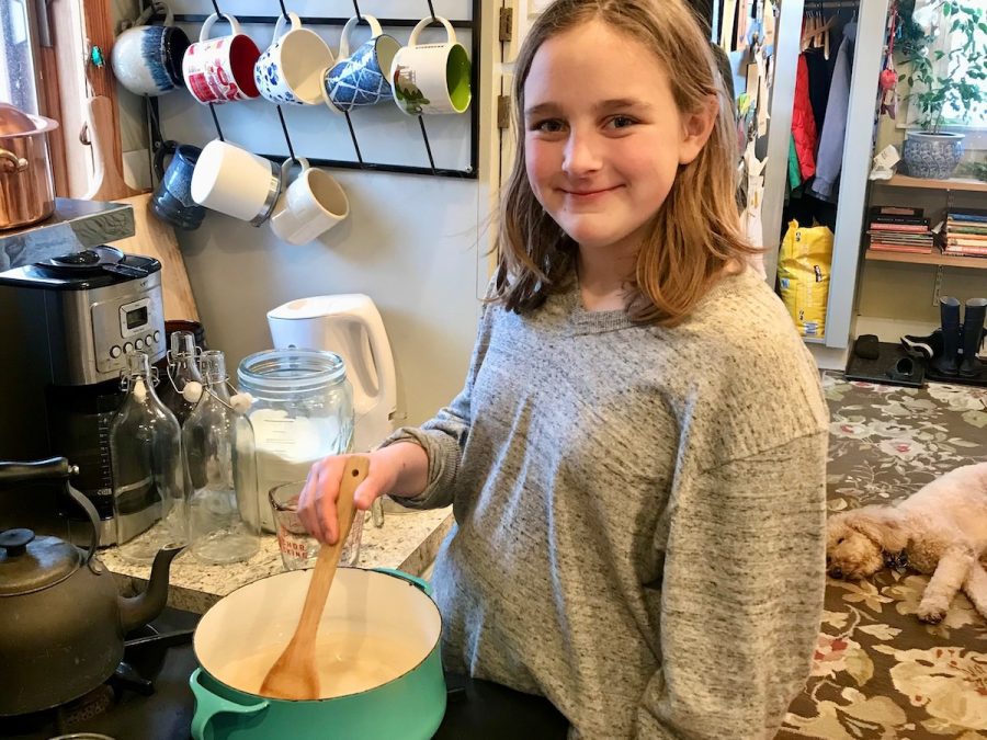 A Challenge A student stirs a mixture on the stove for science fair