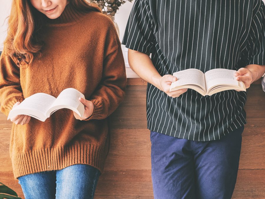 Three young people enjoyed reading poetry together.