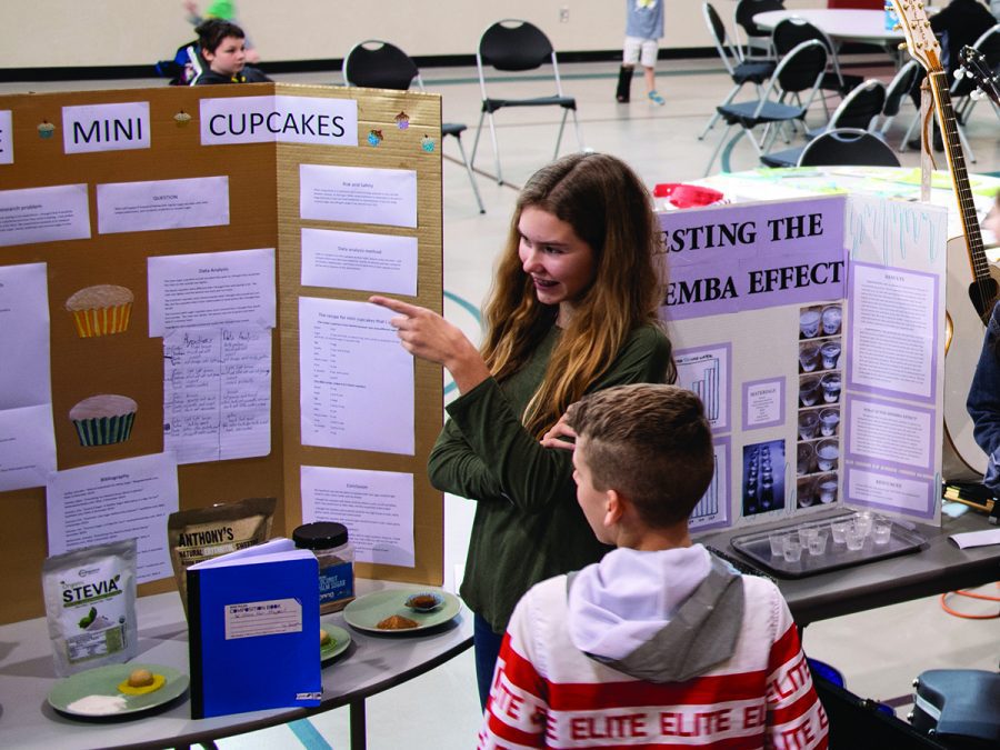 a student presents her Challenge A Science Fair project