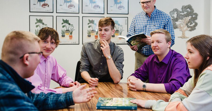 Challenge students discuss a topic in community during an Excellence in Education event.