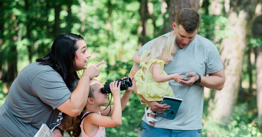 A homeschool family practicing the five core habits of grammar outside