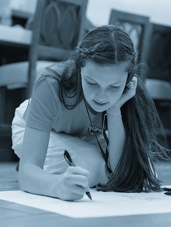 Girl drawing a map at National Memory Master