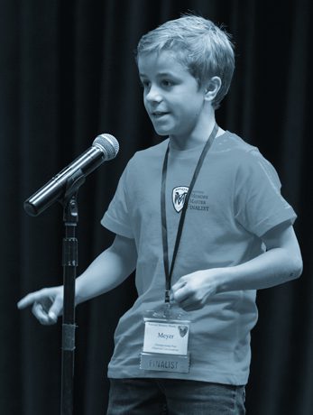 Boy speaking at National Memory