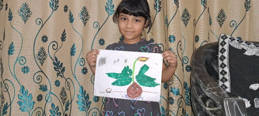 a homeschool student shows her drawing of an onion