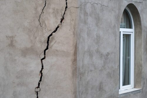 Closeup of cracked foundation - a metaphor for education