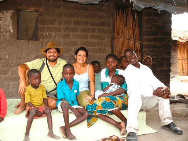 Missionaries Naara and her husband with a family in Malawi.