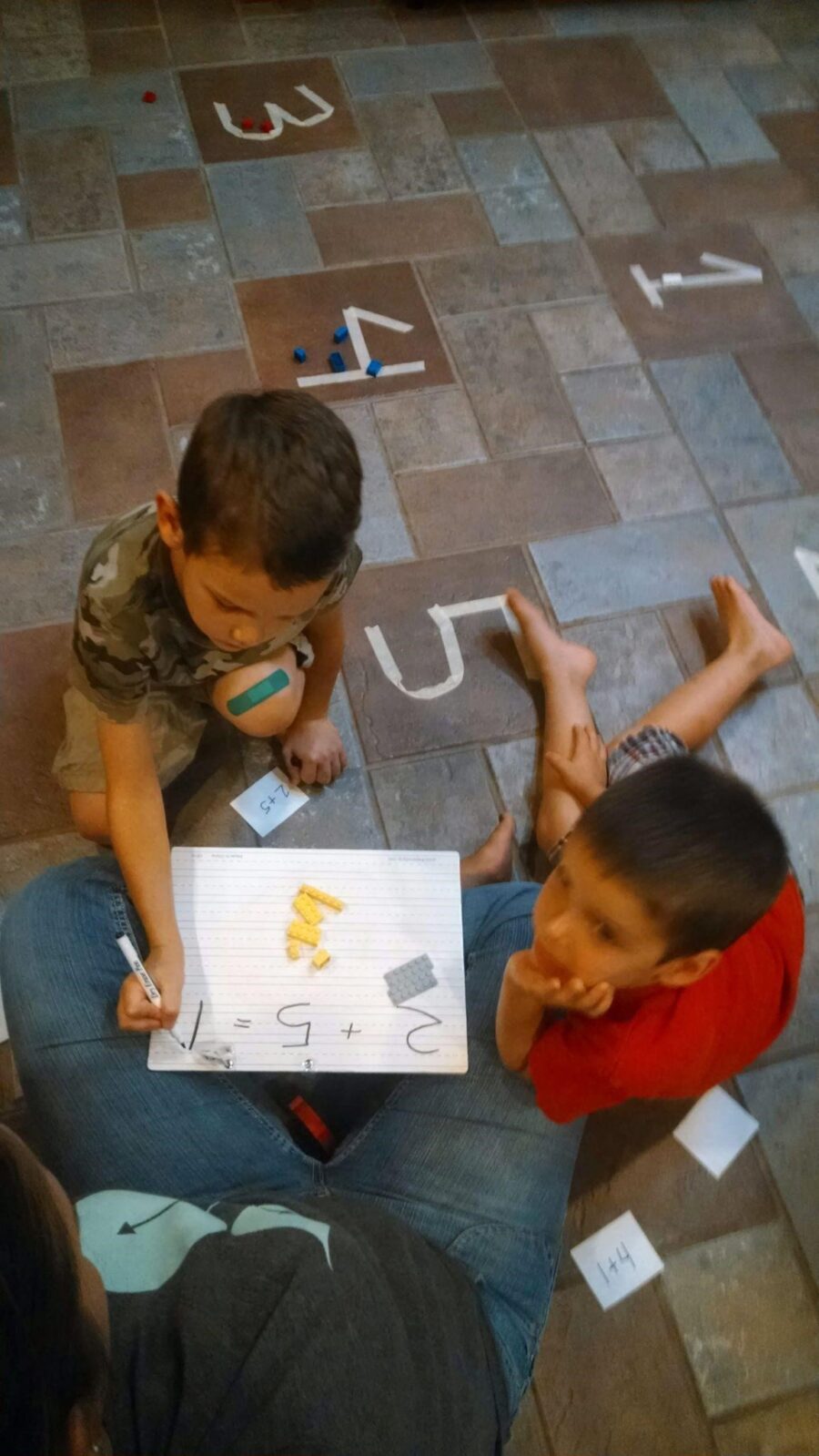 Children practicing math at home.