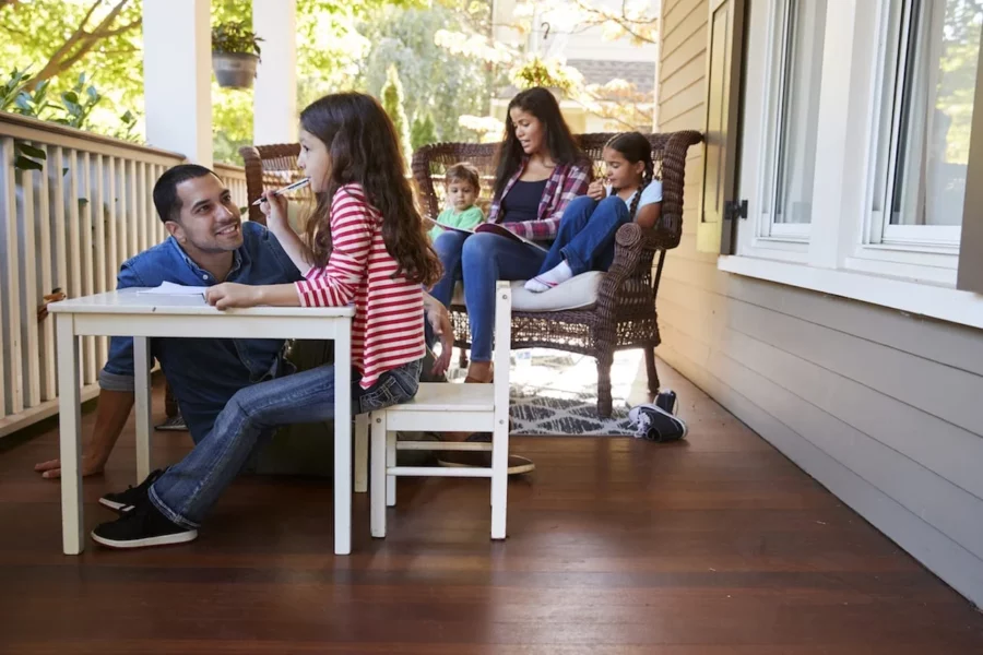 A family homeschools on the porch.