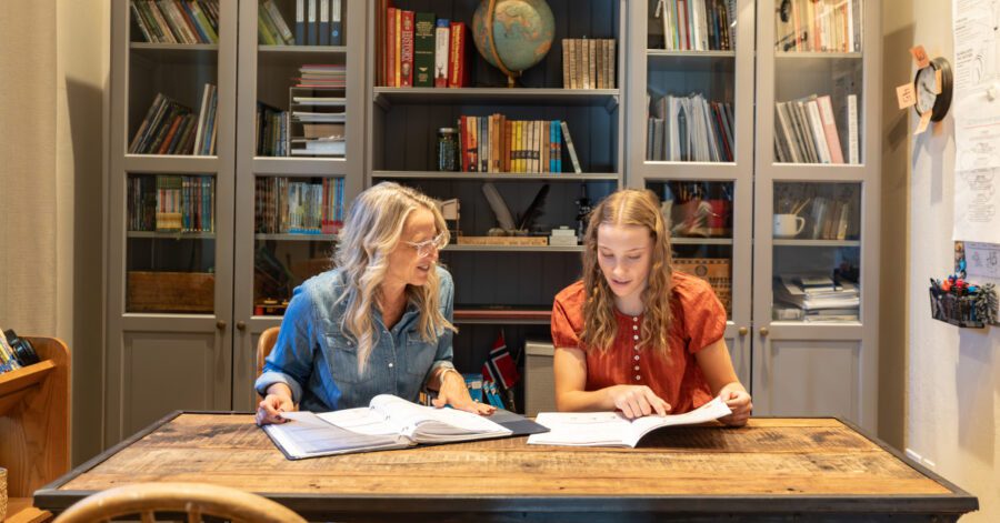A mother and daughter planning their homeschool schedule