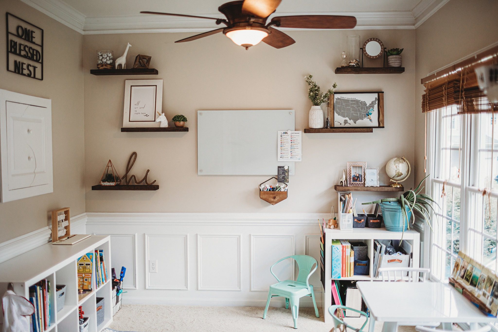 Beautiful homeschool room with pink and white walls.