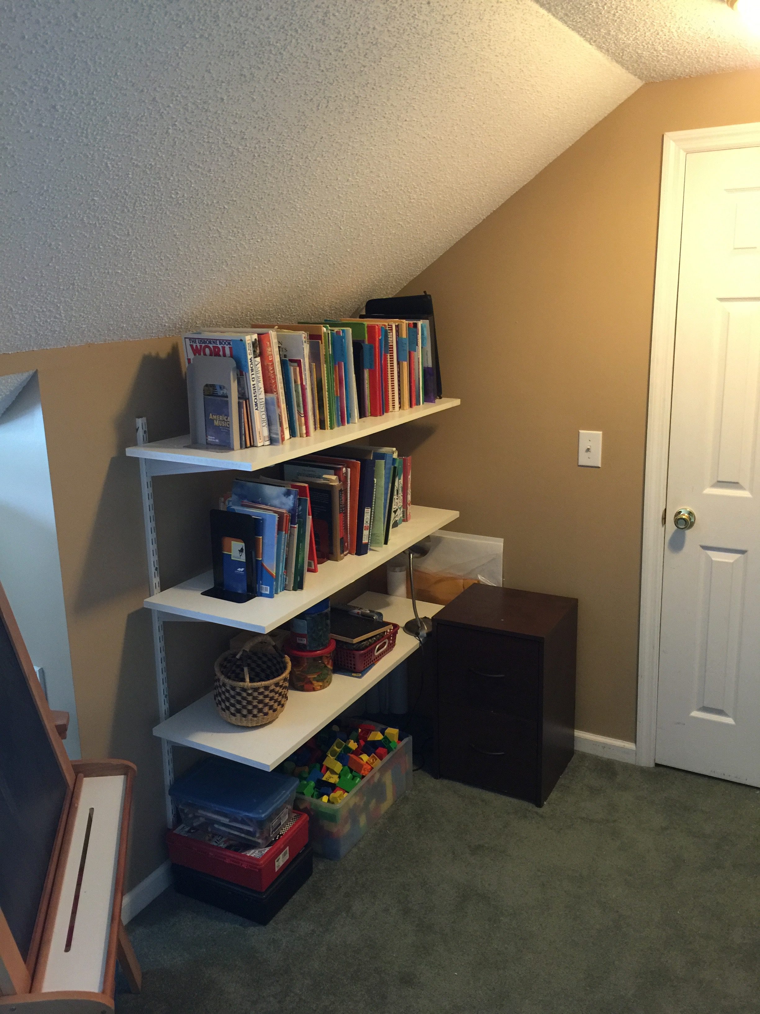 Floating bookshelves with homeschool curriculum.