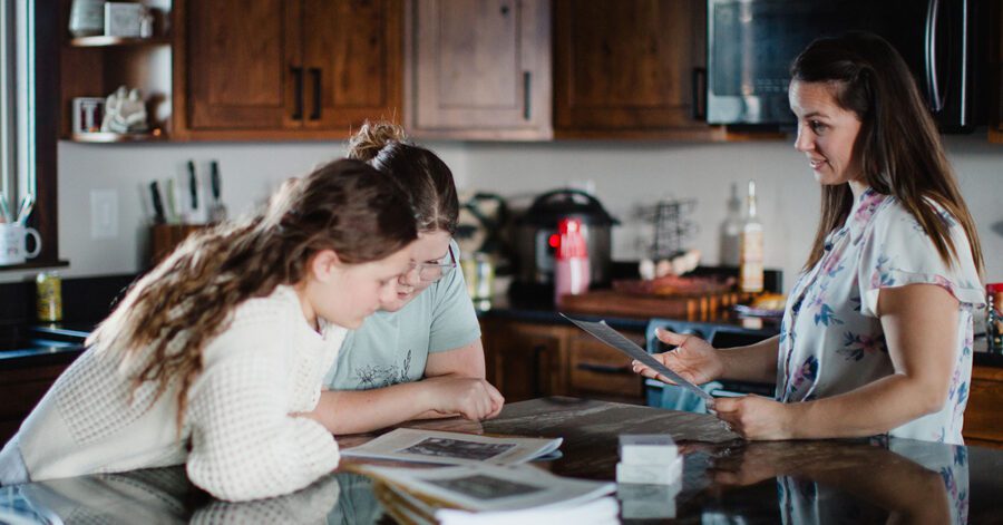 homeschool high school students learning around a kitchen