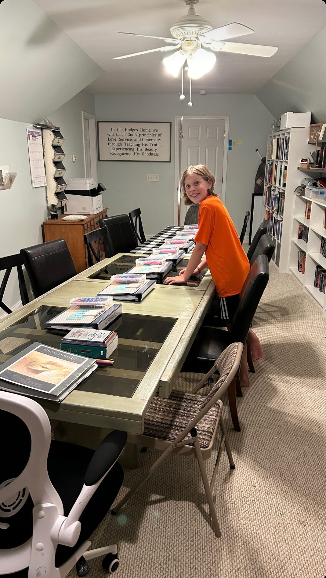 Boy in an orange shirt preparing for a homeschool community day.