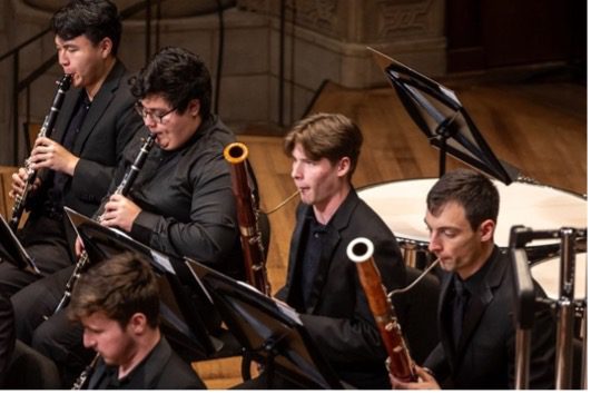 Homeschool student plays bassoon in an orchestra.