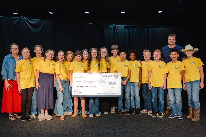 The 2025 National Memory Master finalists on stage with Robert and Leigh Bortins