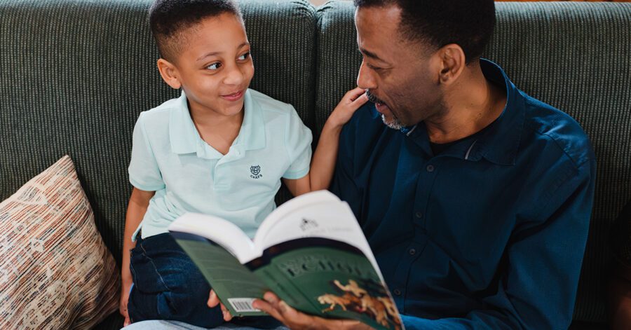 Homeschool father giving phonics reading instruction