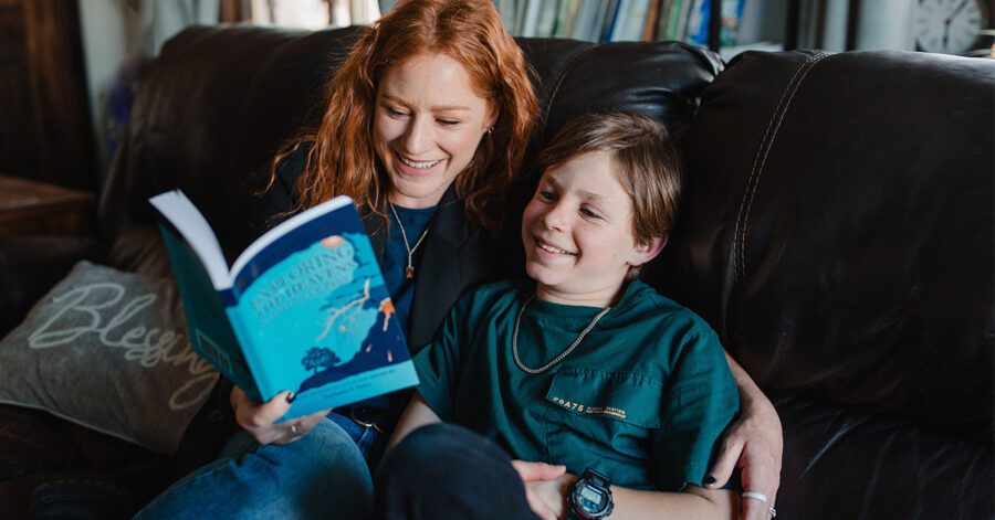 Homeschool mother and son learning phonics together