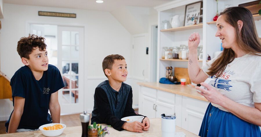 Intentional homeschool mom and sons using flashcards