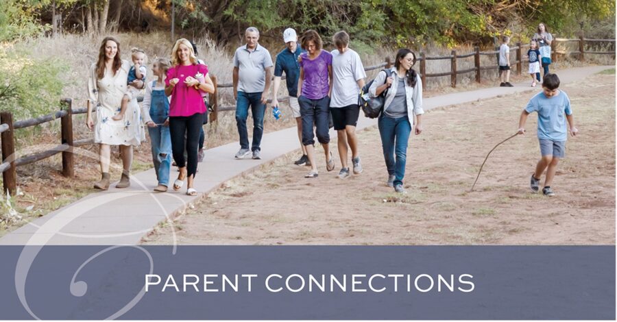 Homeschool families walking together outdoors at a Classical Conversations community event