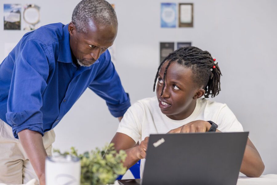 CC Kenya Classical Conversations Challenge student with Dad at computer