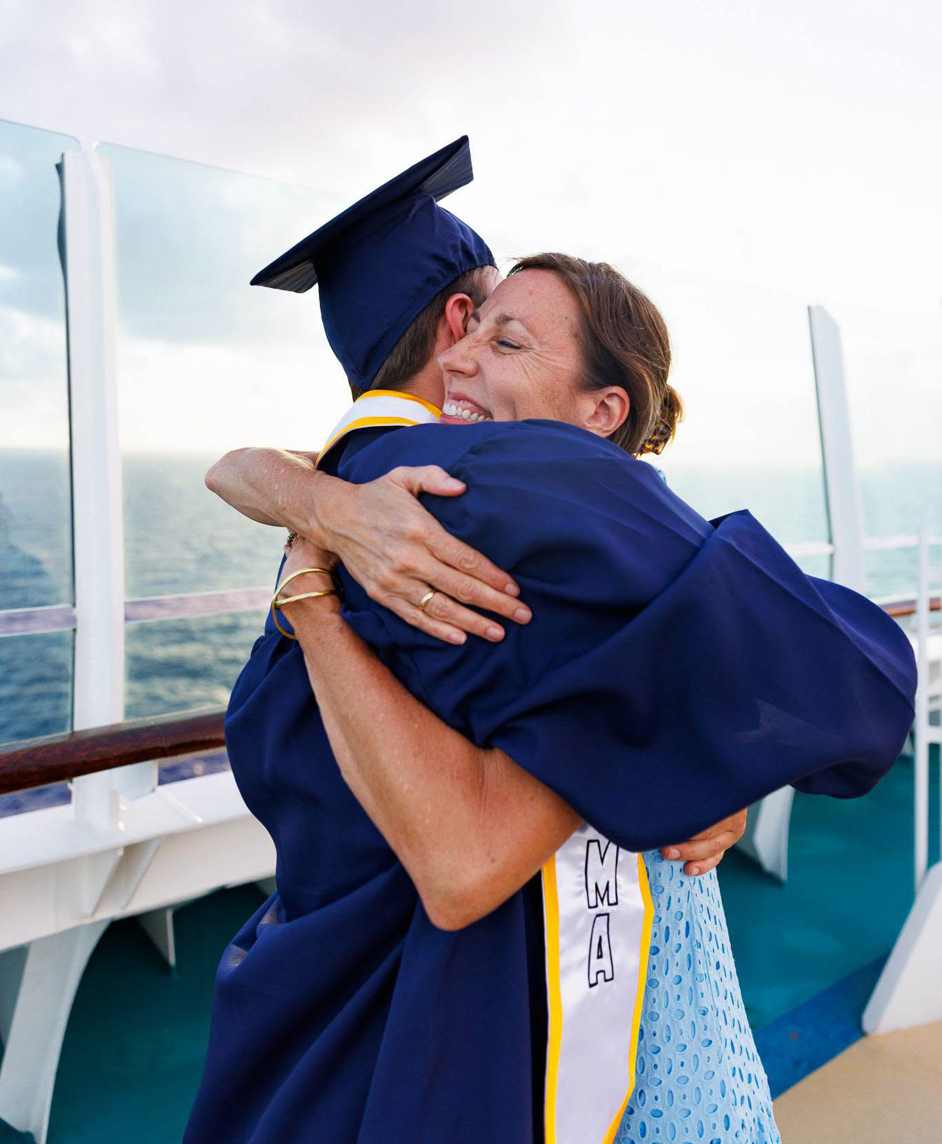 Mother and son hugging at Classical Conversations Commencement