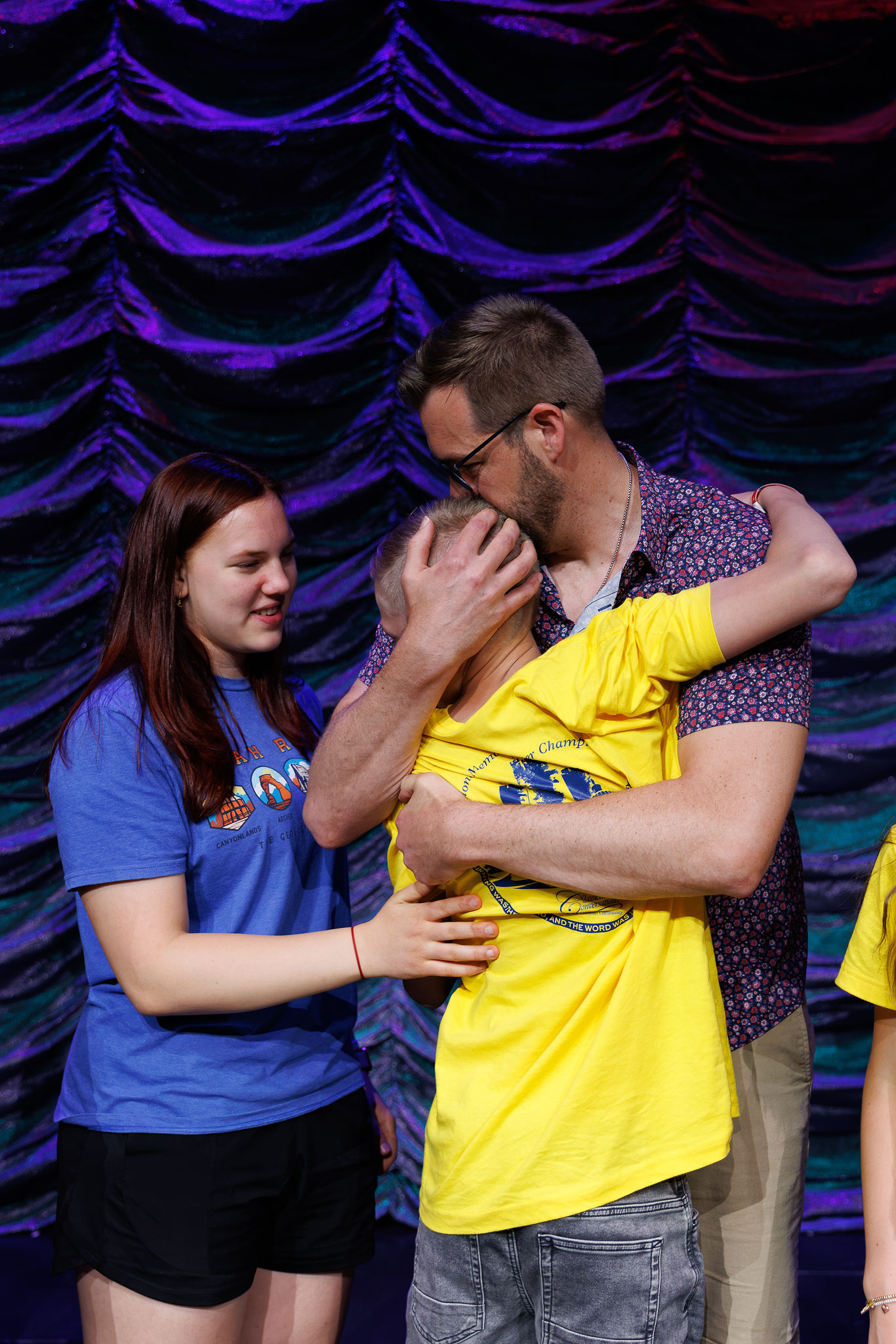 Nilolai's family hugs him after he is announced the winner