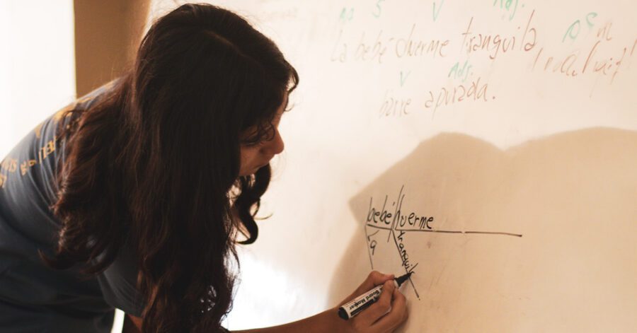 student writing on the board for Classical Conversations Essentials