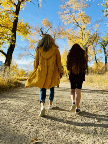 Homeschooling mother and daughter walking in Canada
